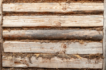 wall texture of an old wooden house made of logs