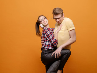 funny students in love on a yellow background