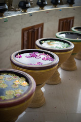 water basin style and flower candle, religion buddhism culture.