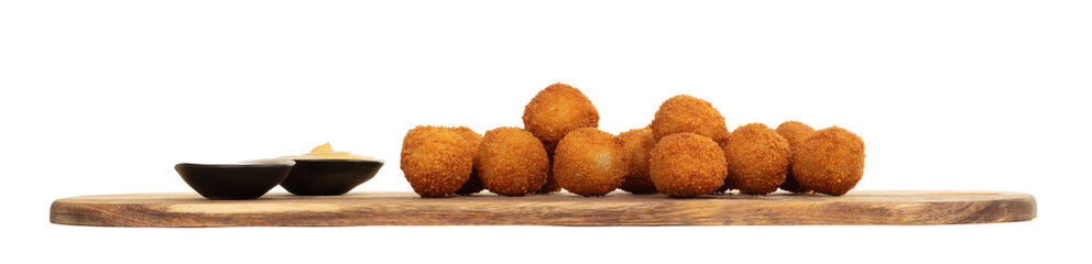 Dutch traditional snack bitterbal on a serving board