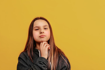 Beautiful young girl with a wistful face. Important decision.