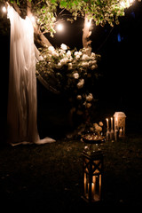 wedding ceremony decoration in the dark, beautiful wedding decor, flowers