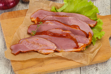 Sliced smoked duck breast served salad