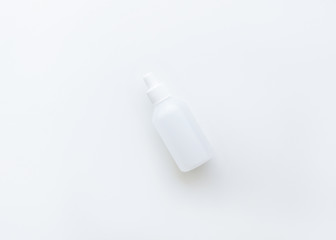 white medical bottle with a sanitizer for hygiene or cosmetic actions