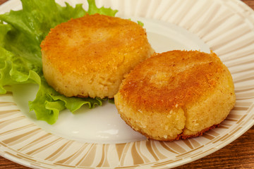 Vegan cuisine - Potato cutlet in the plate