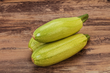 Young tasty zucchini over board
