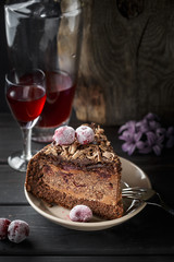 Slice of homemade chocolate cake and cherry liquor
