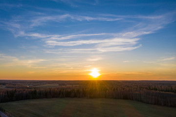 The white disk of the setting sun and the endless fields and forests of Russia.