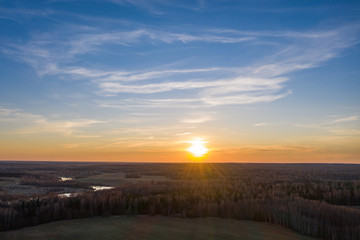 The white disk of the setting sun and the endless fields and forests of Russia.