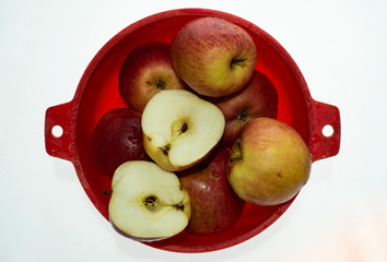 ripe juicy apples with drops of water after washing isolated on white background