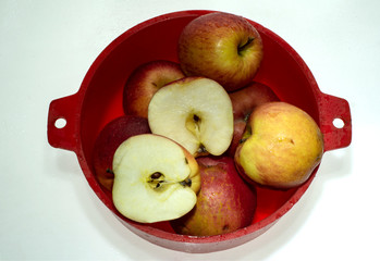 ripe juicy apples with drops of water after washing isolated on white background