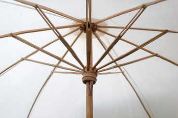 Closeup of fabric umbrella with bamboo frame assemble