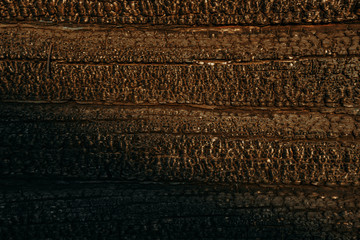 The effects of fire. The charred house. Wooden texture of a burned-down house. Black soot | KOROVYAKOVA, SVERDLOVSKAYA OBLAST - 9 MAY 2020.