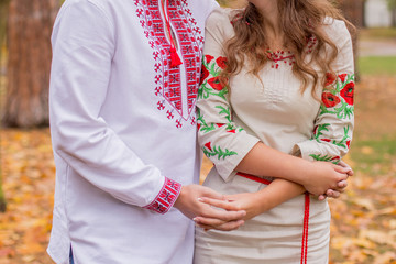 man with woman in folk clothes in autumn