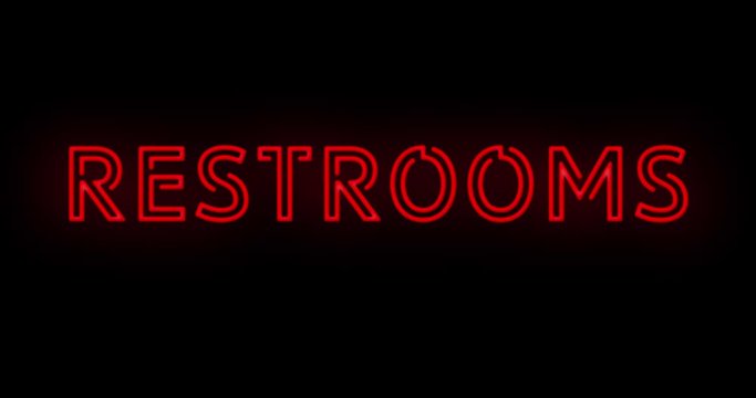 Flashing red RESTROOMS sign on and off with flicker on and off on black background