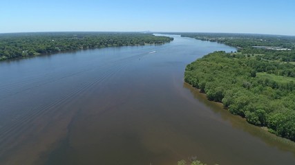 Bird's eye view of a winding river and trees on either side.