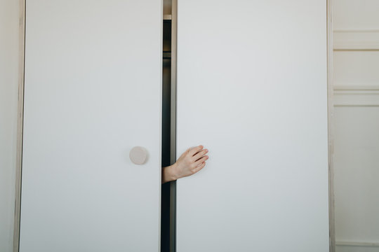 hand in a wardrobe