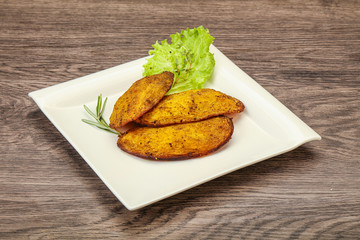 Baked potato with herbs and spices
