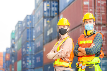 Fototapeta na wymiar Success Teamwork Concept, Business people engineer and worker team wearing protection face mask against coronavirus with arms crossed as sign of success blurred container box background