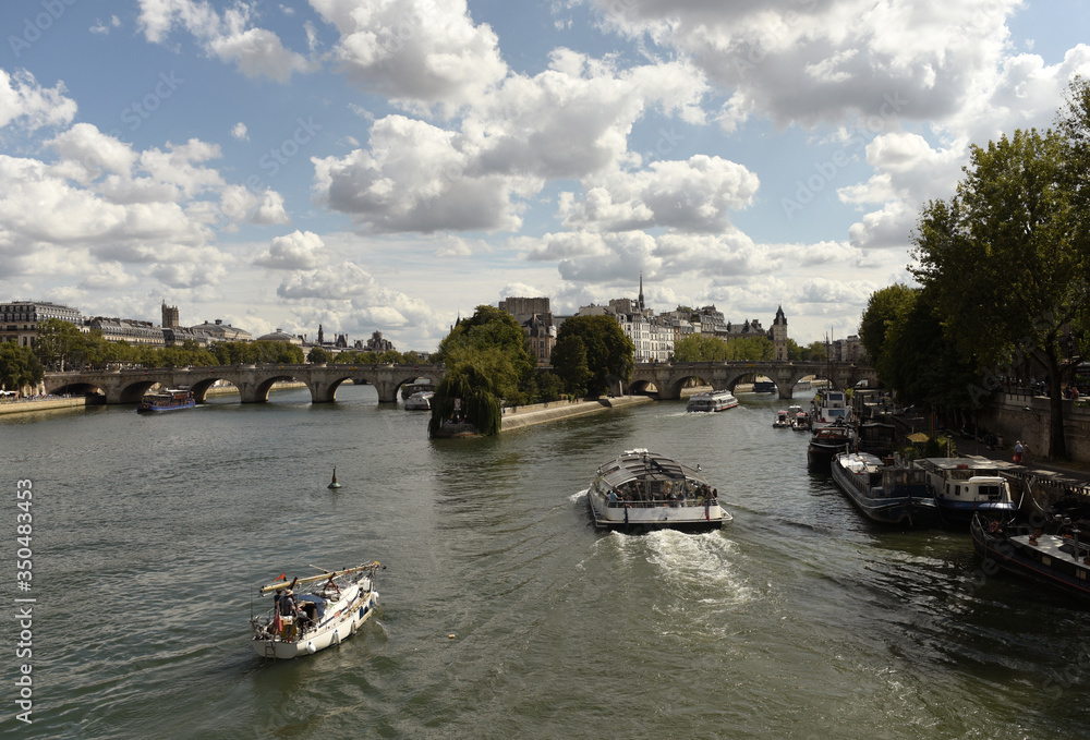 Wall mural tourist ship on the seine river in paris, france