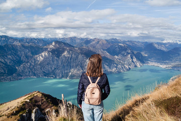 Tourist on viewpoint of Monte Baldo on Lake Garda in autumn