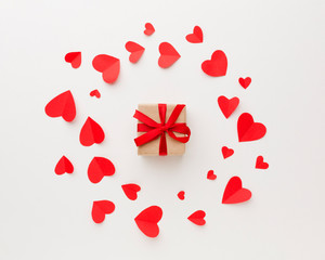 Top view of gift with paper heart shapes