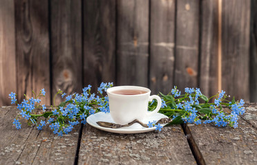 a Cup of tea in the garden with flowers
