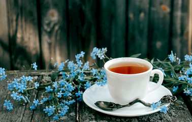 a Cup of tea in the garden with flowers