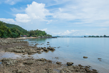 Abstract stone on the beach with mountain landscape