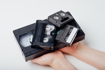 close up, video tape in child hand, isolated on white background, top view - obrazy, fototapety, plakaty