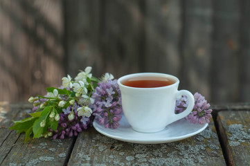 a Cup of tea in the garden with flowers