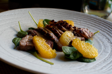 Juicy duck breast steaks with caramelized citrus