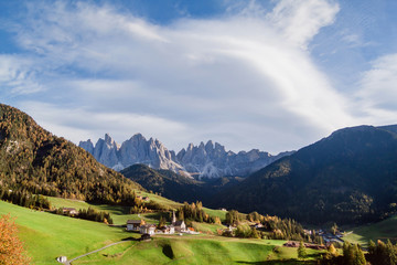 Mountain peaks and the church of Santa Maddalena in Val di Funes, South Tyrol, Italy