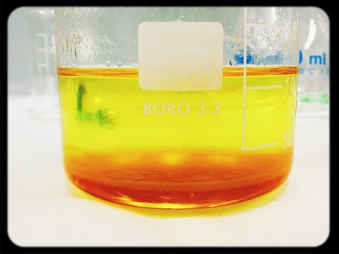 Yellow And Orange Fluid In Flask