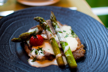 Roasted meat steak carbonara cheese sauce asparagus