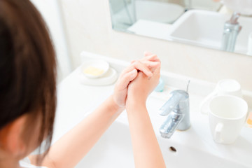 Asian little girl washing hands