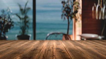 wooden table in front of abstract blurred background,3d rendering,conceptual image.
