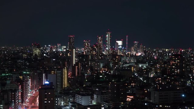 Aerial view of Ikebukuro district at night. 4K time-lapse.