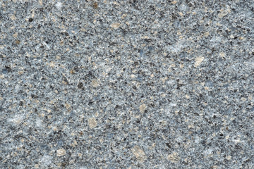 Texture of granite stone wall for background.