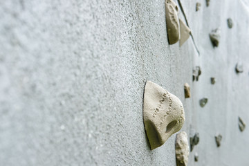 Outdoor climbing wall, an artificially constructed wall with grips for hands and feet.