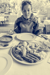 Hungry woman waiting to start eating her dish.