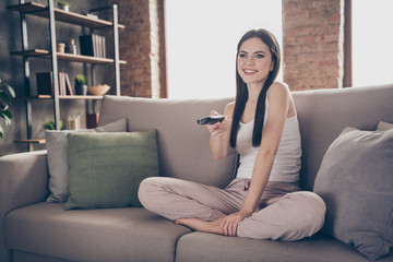 Obraz premium Full body photo of charming people dream dreamy sit divan remote control switch channel watch interesting film in living room apartment indoors