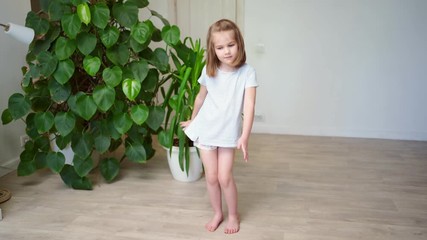 funny little girl dancing and having fun at home.