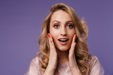 Image of young excited woman expressing surprise on camera