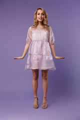 Full length photo of nice pleased woman posing and looking at camera