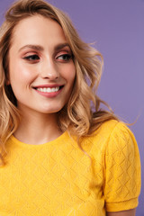 Image of nice cheerful woman smiling and looking aside