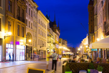 Fototapeta na wymiar Torun city historical streets and building at evening in Poland
