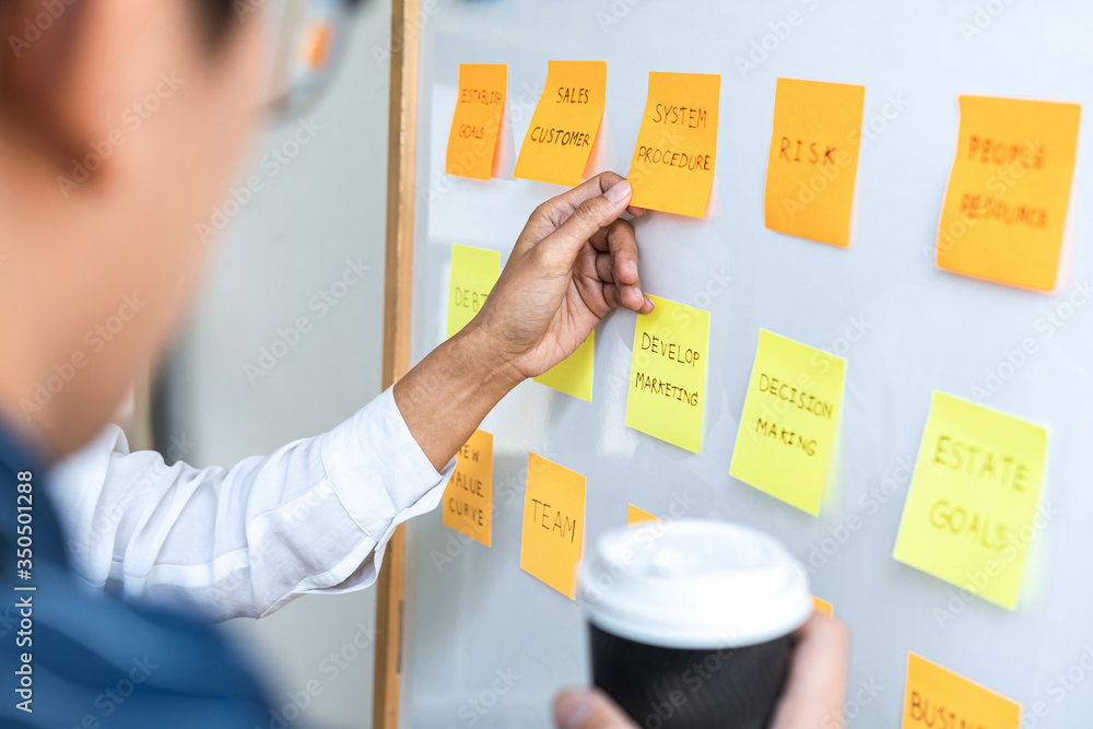 Aufkleber Two creative Business people meeting and planning use post it notes sticky note on board to share idea, Analysis data charts and graph with teamwork strategy brainstorming