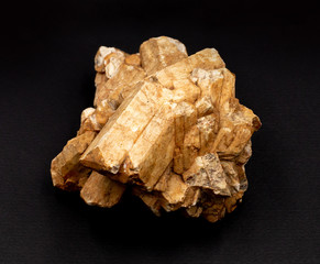 Cluster of feldspar mineral crystals isolated dark background. Geology mineralogy magazines websites articles, collection catalogs, stone encyclopedia, Natural Science museum posters wall charts