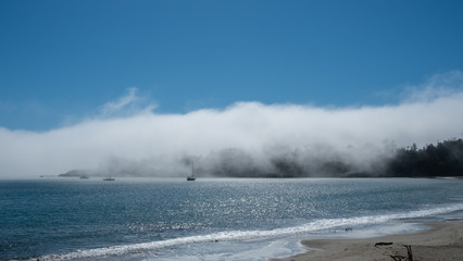 mist over Los Ojos bay and the sea
